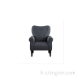Fauteuil d'appoint avec accoudoirs en tissu bleu marine boutonné